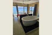 3/54 - WEDDING BED 1 WITH BATH LOOKING OUT TO SEA